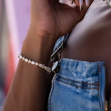Pulsera de tenis de oro amarillo con estrellas y circonitas redondas