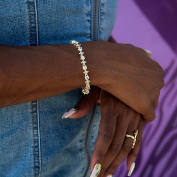Pulsera de tenis de oro amarillo con estrellas y circonitas redondas