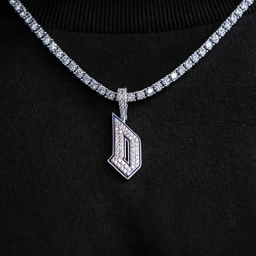 Colgante oficial con el logotipo de los Duques de Duquesne de la NCAA