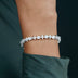 Pulsera de tenis de oro blanco con estrellas y piedras redondas
