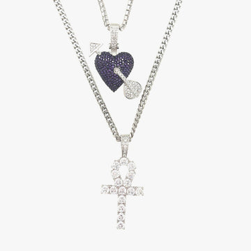 Conjunto de corazón y cruz en oro blanco