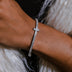Pulsera de tenis con cruz