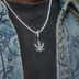 Dije de hoja de marihuana de diamante en oro blanco
