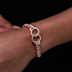 Pulsera cubana de oro rosa con eslabones y diamantes engastados