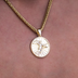 Colgante de moneda Nike Crowning