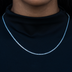 Collar de tenis de microdiamantes y topacio azul en oro blanco