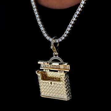 Colgante con clip para bolso con incrustaciones en oro amarillo
