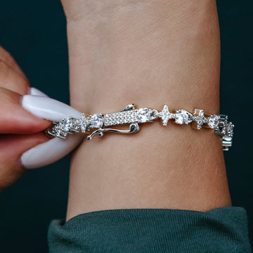 Pulsera de tenis de oro blanco con estrellas y piedras redondas