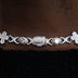 Cadenas cubanas de oro blanco con cruces de baguette, ojo turco y eslabones de diamantes, más pulsera a juego