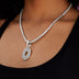 Dije de telaraña con diamantes en oro blanco