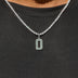 Dije número Micro Block en oro blanco