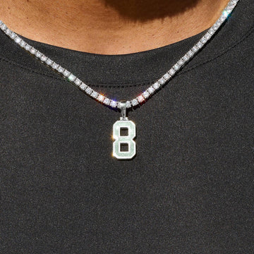Dije número Micro Block en oro blanco