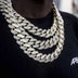 18” 20" and 22" Diamond Cuban Link Chokers (19mm) in yellow gold covered in hand set CZ stones worn together by a male model in a black t-shirt.