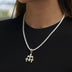 Micro colgante de triple cruz con circonitas en oro amarillo