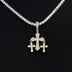 Micro colgante de triple cruz con circonitas en oro amarillo