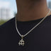 Micro colgante de triple cruz con circonitas en oro amarillo