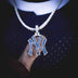 New York Yankees MLB logo pendant in 14k white gold plating with natural blue gemstones. Pictured on a 3mm Round Cut Tennis Necklace in White Gold, model holding pendant out on thumb to show detail. 