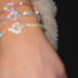 Pulsera de tenis con corazón de oro amarillo