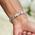 Pulsera Cadena de Tenis XOXO Helada en Oro Blanco