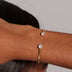 Pulsera Abierta con Piedras de Talla Redonda en Oro Amarillo
