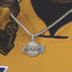 LA Lakers Pendant covered in corresponding color CZ stones, on a matching 20” 3mm Tennis Chain in yellow gold, worn by a male model in a LA Lakers Jersey. 